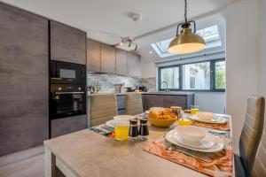 a kitchen with a table with plates of food on it at 2 Bed in St. Ives oc-e28156 in St Ives