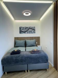 a bedroom with a bed with two pillows on it at BEST VIEW Winterberg - Kleines Studio Apartment in Winterberg