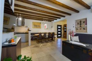 a kitchen and living room with a table and chairs at Villa Peaceful Valley in Šestanovac