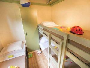 a small room with bunk beds in it at Chalet 5 Pers avec Terrasse - API-1-52-1125 in Vendoire +13 photos