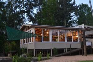 a building with a lot of windows at Cabaña DEK in Tigre