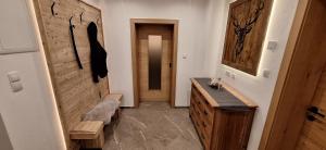 a bathroom with a wooden door and a wooden sink at alter Hannelerhof in Mutters