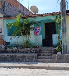 a building with a flag on the front of it at Casa da gamboa in Cairu