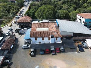 an overhead view of a building with cars parked in a parking lot at Casona El Nacional in San Gil +14 photos