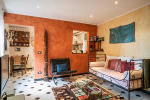 a living room with a bed and a fireplace at Romantic Sea View Flat in Genova in Genoa
