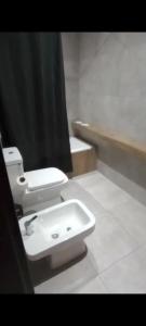 a bathroom with a toilet and a sink at Departamen dos ambientes in Buenos Aires