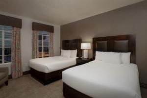 a hotel room with two beds and a window at Golden Gate Casino Hotel in Las Vegas +17 photos