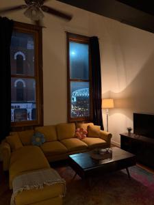 a living room with a couch and a table at The Lofts at 107 in Nashville