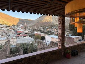 a view of a city from a balcony at Hotel Ruinas Del Real in Real de Catorce +9 photos