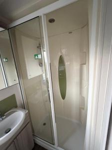 a bathroom with a shower and a sink at RelaxDream in Port Seton