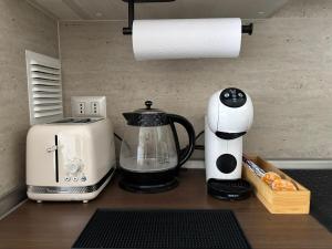 a coffee maker and a blender on a counter at Apartment steps away from the beach in La Serena
