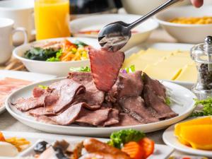a plate of food with meat on a table at APA Hotel Shinjuku Kabukicho Tower in Tokyo