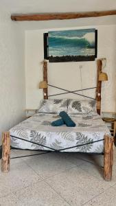 a bed with a wooden headboard in a bedroom at Chiwash Place Taghazout in Taghazout +48 photos