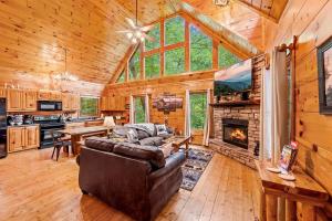 a living room with a couch and a fireplace at A Bear's view in Sevierville