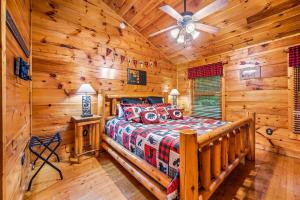 a bedroom with a bed in a log cabin at A Bear's view in Sevierville