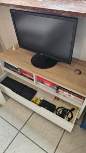 a computer monitor sitting on top of a desk at Holiday Everyday in Hemer in Hemer