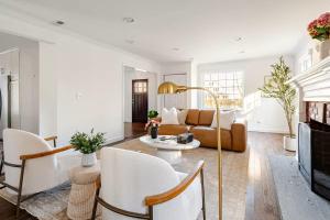 a living room with a couch and a table at Norwalk Retreat in Norwalk