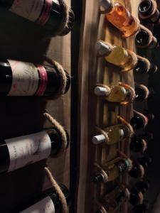 a bunch of wine bottles in a wine cellar at Azure palms hideaway in Kingston