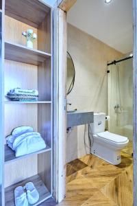 a bathroom with a toilet and a sink and a shower at Dar Charkaoui Refugio de Silencio & Hospitalidad Familiar in Tétouan +68 photos