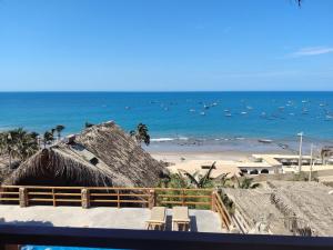 a view of a beach with boats in the water at Departamento 1 dormitorio in Máncora