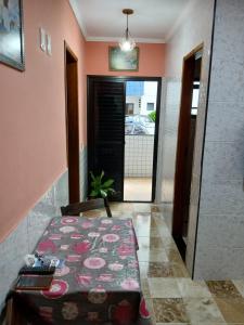 a room with a bed and a hallway with a door at Ed.fragatas residence in Bertioga +24 photos
