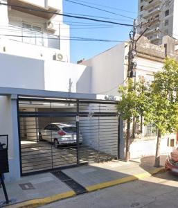 a car is parked inside of a garage at Apart del Puerto 01 cochera opcional in Santa Fe