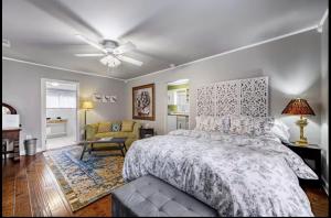 a bedroom with a bed and a ceiling fan at Peaceful Private Cottage, Walk to Park & 5 Mins to Downtown in Nashville