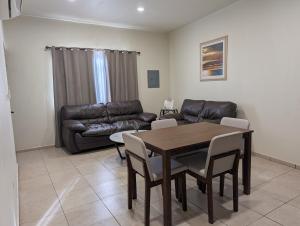 a living room with a table and a couch at Departamento Y in Loreto