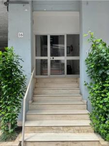 a set of stairs leading to a building at City Center Piazza Studio in Tirana