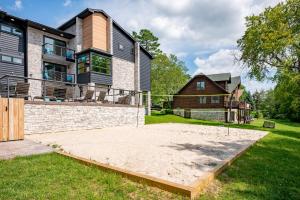a large house with a volleyball court in the yard at Sweet Dreams by Railey Vacations in McHenry