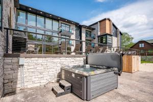 a barbecue grill on the back of a house at Sweet Dreams by Railey Vacations in McHenry
