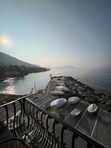 a row of boats parked on a dock next to the water at HyggeWaves in Bogliasco