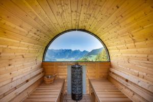 an inside of a wooden sauna with a window at Villa mit Seeblick in Amden +34 photos