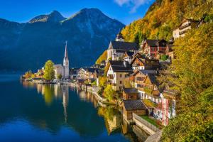 a town on the shore of a lake with mountains at Apartment in Öblarn 42010 in Öblarn