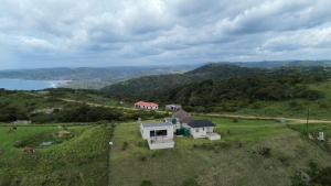 an aerial view of a house on a hill at Sunrise On Sea Backpackers in Port St. Johns