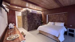 Cama ou camas em um quarto em Hotel Toconar mais 21 fotos