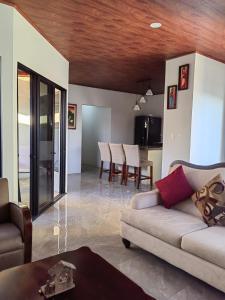 a living room with a couch and a table at SJO - Casa Taccari in Grecia
