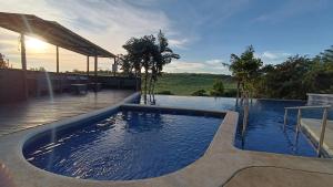 a swimming pool in the middle of a house at SJO - Casa Taccari in Grecia