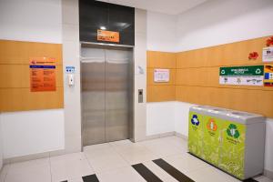 an elevator in a hospital lobby with a metal door at Pusat Belia Antarabangsa in Kuala Lumpur
