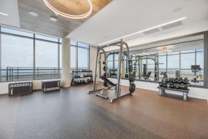 a gym with treadmills and cardio equipment in a building at Penthouse Retreat with Rooftop Pool Explore Silver Spring & Washington DC in Silver Spring