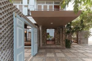an open door to a house with a balcony at Villa Monsoon in Mount Lavinia