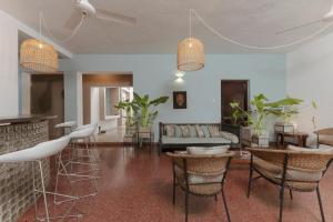 a living room with chairs and a couch at Villa Monsoon in Mount Lavinia