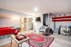a living room with a bed and a flag on the wall at Updated Apt with Private Entry and FREE Parking in Washington, D.C.