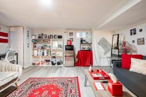 a living room with a couch and a table at Updated Apt with Private Entry and FREE Parking in Washington, D.C.