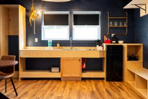 a kitchen with a sink and a window at Hotel Expedition in Red Lodge +48 photos
