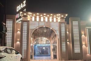 an entrance to a building with an arch way at Hotel Beubelle in Meerut