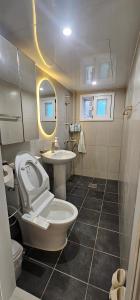 a bathroom with a toilet and a sink at BinsHeim HBC - Seoul's Aesthetic Stay with the best Night view Rooftop in Seoul +78 photos