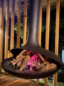 a fire oven sitting on top of a bench at Forest 101 in Infanta