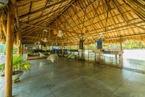 a large pavilion with a table and chairs in it at Paraíso By Elemnt Rentals in Santa Marta