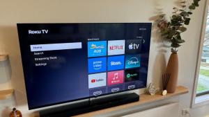 a flat screen tv sitting on top of a shelf at Higgi Drive 6 in Mount Hotham